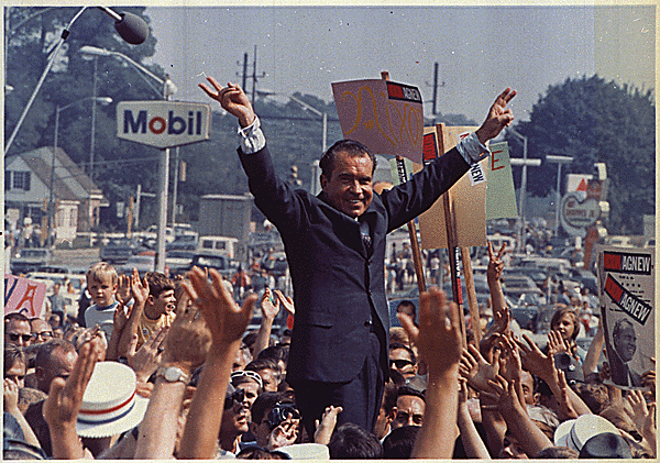 Richard Nixon giving the V-sign at a 1968 campaign rally