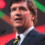 Tucker Carlson speaking at an event in December 2020.
