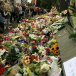 Flowers and handwritten tributes left for the victims of the Christchurch mosque shootings on Rolleston Avenue, Christchurch, New Zealand