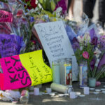 Flowers and tributes at the memorial to the victims of the Tops supermarket shooting on Jefferson Avenue in Buffalo, New York